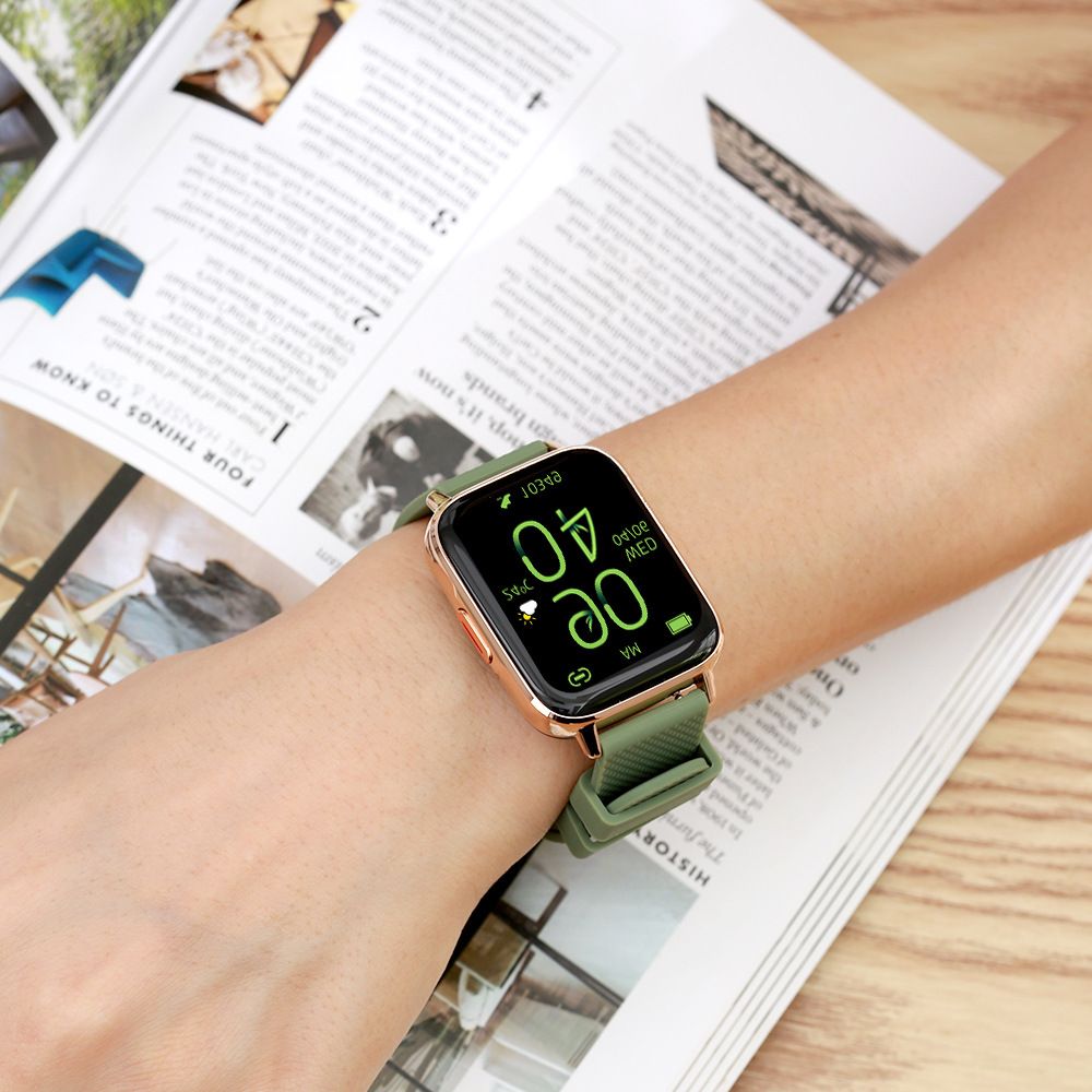 Smartwatch with a green strap on a wrist